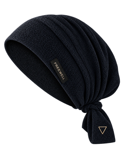 The Ritual Cap in dark navy merino wool with silk-lined interior